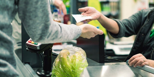 Briar Poirier, from Oxford, Massachusetts, is a cashier at his local grocery store and he recently helped a customer pay for his grocery bill. (iStock)