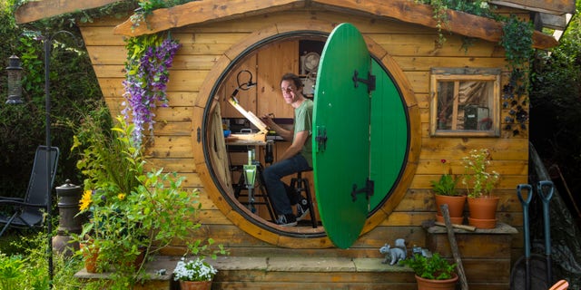 It apparently took Hughson six months and about $2,781 (£2,000) to build his 6.5-foot tall workshop, complete with the iconic green round door.