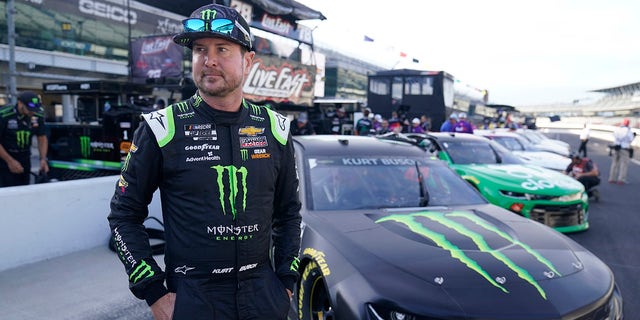 Kurt Busch walks in the pits before qualifying for the NASCAR Series Auto race at Indianapolis Motor Speedway, Sunday, Aug. 15, 2021, in Indianapolis.
