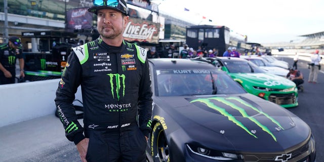 Kurt Busch walks in the pits before qualifications for the NASCAR Series auto race at Indianapolis Motor Speedway, Sunday, Aug. 15, 2021, in Indianapolis.