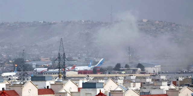 Smoke rises from explosion outside the airport in Kabul, Afghanistan, Thursday, Aug. 26, 2021.