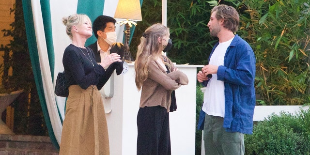 Melanie Griffith is seen leaving dinner as she celebrates her 64th birthday with her youngest daughter Stella Banderas and a male companion.