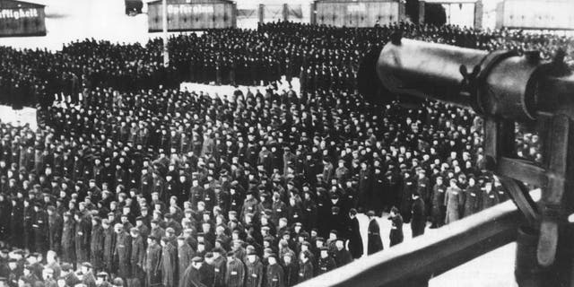 This undated file photo shows a roll call, in the early morning or late evening hours, on the roll call square in front of the camp gate of the Nazi concentration camp Sachsenhausen in Oranienburg on the outskirts of Berlin, Germany. (AP Photo, file)