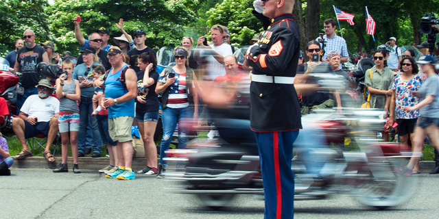 U.S. Marine Corps Veteran Staff Sergeant Tim Chambers salutes as thousands of bikers and military veterans take part in the 31st annual Rolling Thunder Ride for Freedom motorcycle parade in Washington, D.C., on May 27, 2018. 
