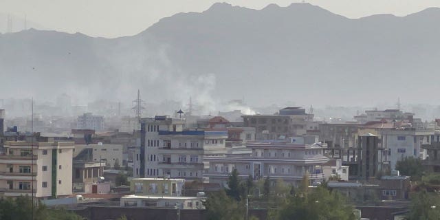 Smoke rises after an explosion in Kabul, Afghanistan, on Aug. 29, 2021. (Photo by Haroon Sabawoon/Anadolu Agency via Getty Images)