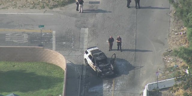 A San Bernardino County Sheriff's deputy was shot Tuesday while trying to make a traffic stop, authorities said. His patrol vehicle was found torched at the scene.