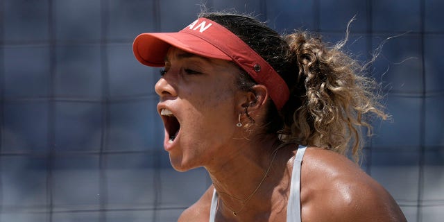 Brandie Wilkerson, of Canada, reacts to winning a women's beach volleyball match against the United States at the 2020 Summer Olympics, Sunday, Aug. 1, 2021, in Tokyo. (Associated Press)