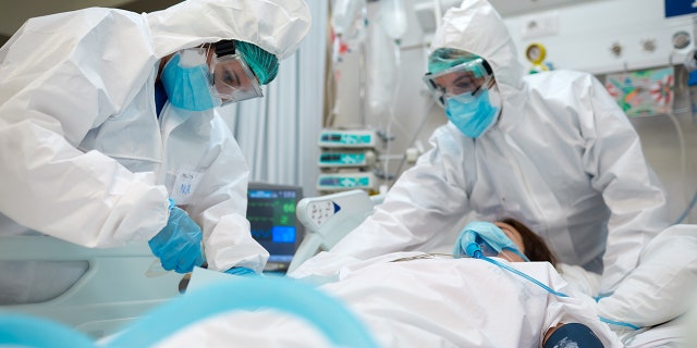 Healthcare workers during an intubation procedure to a COVID-19 patient