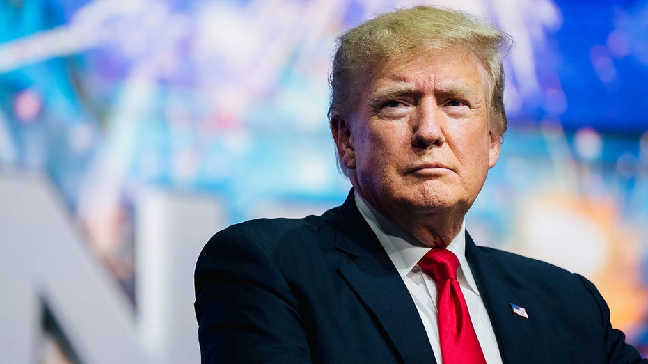 PHOENIX, ARIZONA - JULY 24: Former U.S. President Donald Trump prepares to speak at the Rally To Protect Our Elections conference on July 24, 2021 in Phoenix, Arizona. The Phoenix-based political organization Turning Point Action hosted former President Donald Trump alongside GOP Arizona candidates who have begun candidacy for government elected roles. (Photo by Brandon Bell/Getty Images)