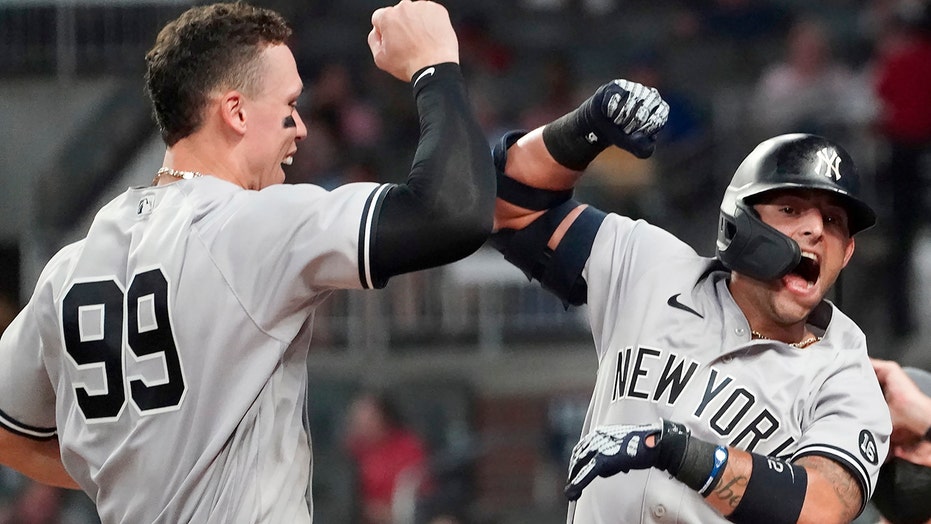 Yankees hit 3 HRs, hold off Braves 5-4 for 11th straight win