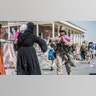 A Marine with Special Purpose Marine Air-Ground Task Force-Crisis Response-Central Command (SPMAGTF-CR-CC) provides water to families during an evacuation at Hamid Karzai International Airport, Kabul, Afghanistan, Aug. 22. U.S. service members are assisting the Department of State with an orderly drawdown of designated personnel in Afghanistan. (U.S. Marine Corps photo by Sgt. Samuel Ruiz).
