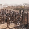 U.S. Marines with Special Purpose Marine Air-Ground Task Force - Crisis Response - Central Command, provide assistance at an Evacuation Control Checkpoint (ECC) during an evacuation at Hamid Karzai International Airport, Kabul, Afghanistan, Aug. 21. U.S. service members are assisting the Department of State with a non-combatant evacuation operation (NEO) in Afghanistan. (U.S. Marine Corps photo by Staff Sgt. Victor Mancilla)