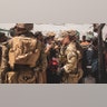U.S. service members provide assistance during an evacuation at Hamid Karzai International Airport, Afghanistan, Aug. 22. U.S. service members are assisting the Department of State with a non-combatant evacuation operation (NEO) in Afghanistan. (U.S. Marine Corps photo by Staff Sgt. Victor Mancilla)