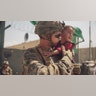 U.S. Marine with the 24th Marine Expeditionary Unit (MEU) calms a crying toddler during an evacuation at Hamid Karzai International Airport, Afghanistan, Aug. 22. U.S. service members are assisting the Department of State with a non-combatant evacuation operation (NEO) in Afghanistan. (U.S. Marine Corps photo by Staff Sgt. Victor Mancilla)