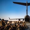 U.S. Marines assigned to the 24th@USMCExpeditionary Unit (MEU) prepare to board a C-17 Globemaster at Al Udeid Air Base, Qatar, en route to Hamid Karzai International Airport in Kabul, Afghanistan.