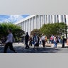 People are evacuated from the James Madison Memorial Building, a Library of Congress building, in Washington on Thursday, Aug. 19, 2021, as law enforcement investigate a report of a pickup truck containing an explosive device near the U.S. Capitol. (AP Photo/Alex Brandon)