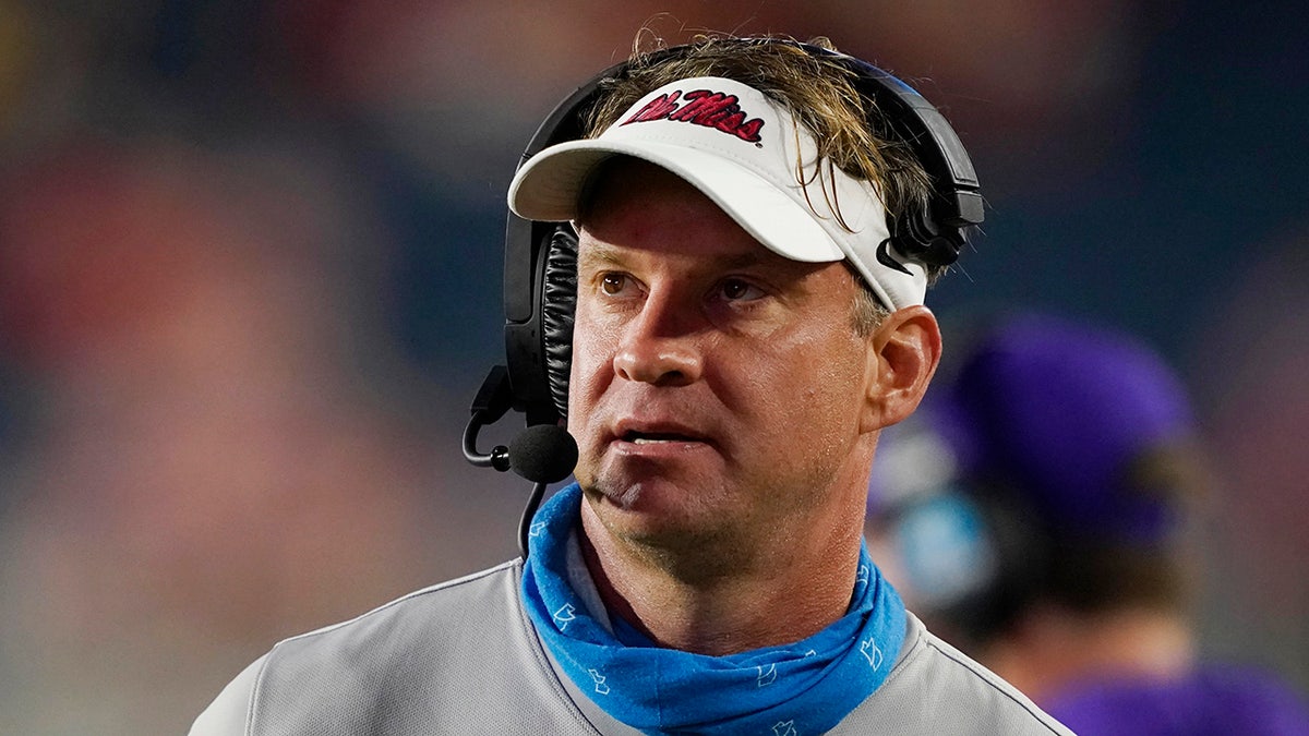 Mississippi head coach Lane Kiffin watches a replay during the second half of the team's NCAA college football game against Tulane on Saturday, Sept. 18, 2021, in Oxford, Miss. Mississippi won 61-21.