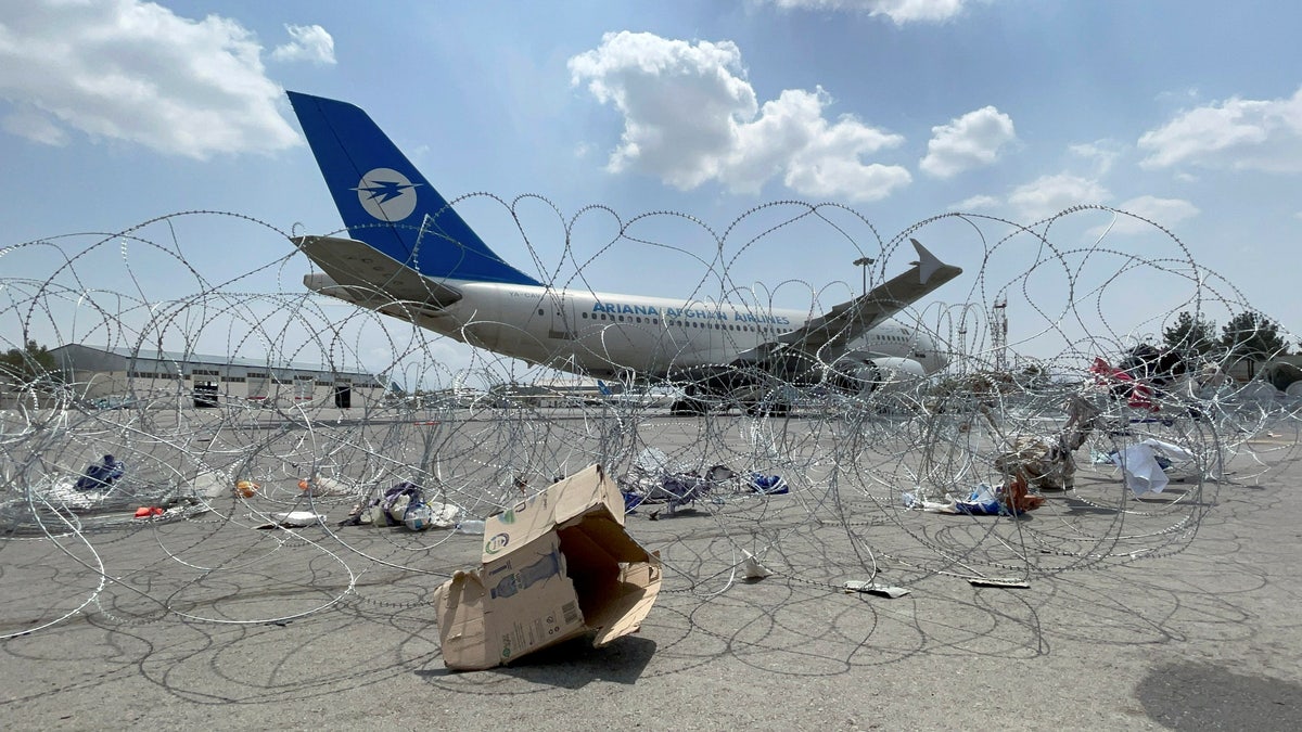 FILE PHOTO: A commercial airplane is seen at the Hamid Karzai International Airport a day after U.S troops withdrawal in Kabul, Afghanistan August 31, 2021. REUTERS/Stringer/File Photo