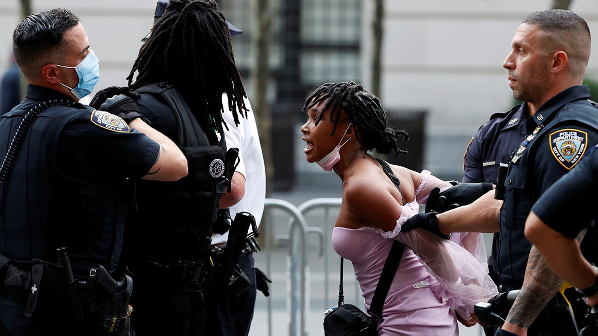 Police detain demonstrators attending a Black Lives Matter (BLM) protest at the Met Gala 2021 at the Metropolitan Museum of Art in New York City, New York, U.S. September 13, 2021. 