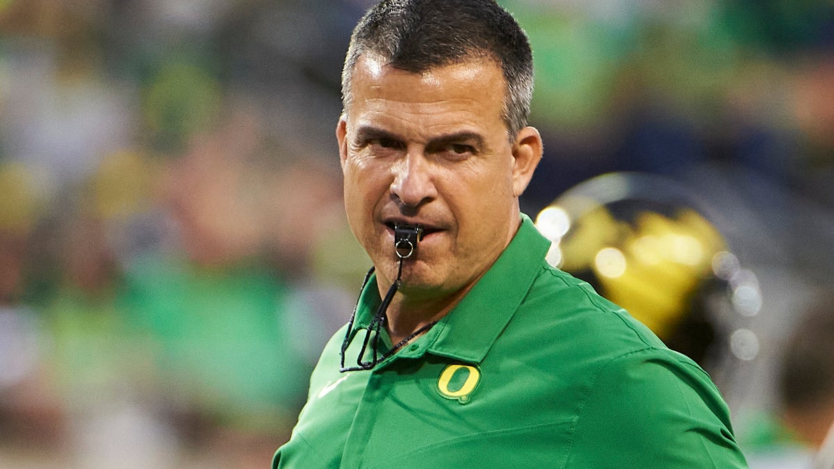 Oregon Ducks head coach Mario Cristobal keeps a watchful eye on players during warmups before a game against the Arizona Wildcats at Autzen Stadium. 
