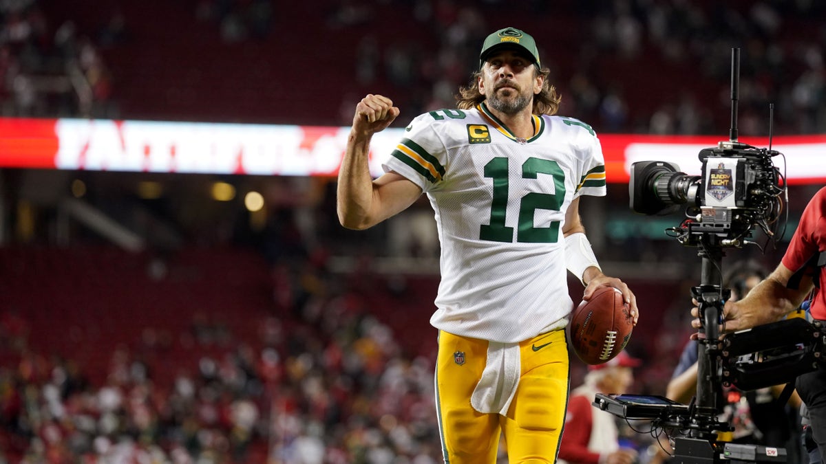 Green Bay quarterback Aaron Rodgers jogs toward the locker room after the Packers defeated the San Francisco 49ers 30-28 on Sept. 26, 2021, at Levi's Stadium in Santa Clara, California.