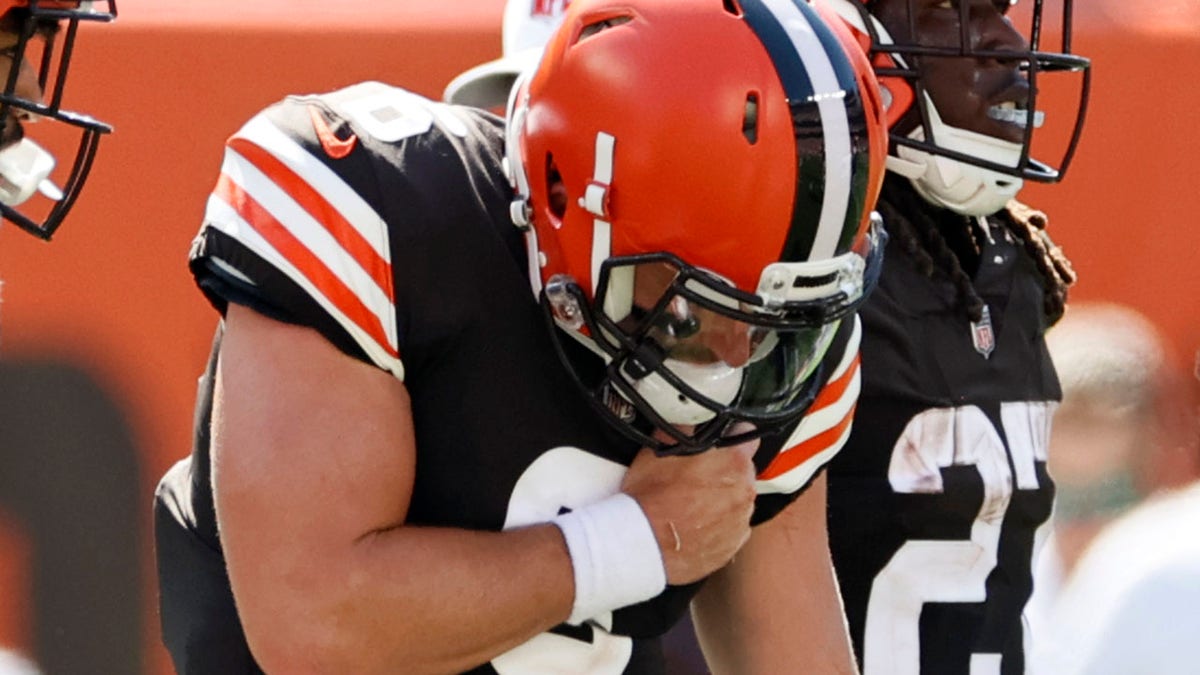 Cleveland Browns quarterback Baker Mayfield holds his shoulder after getting hurt during the first half of an NFL football game against the Houston Texans, Sunday, Sept. 19, 2021, in Cleveland.