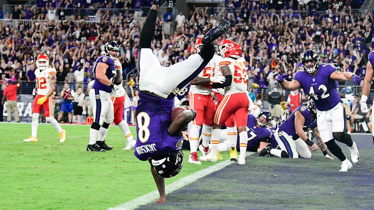 Baltimore Ravens quarterback Lamar Jackson (8) flips into the end zone for a fourth quarter touchdown against the Kansas City Chiefs at M&T Bank Stadium.