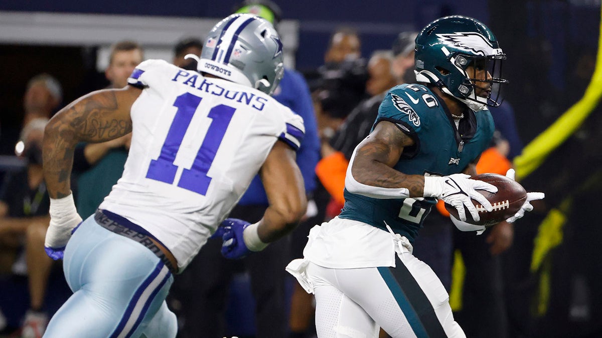 Dallas Cowboys linebacker Micah Parsons (11) gives chase as Philadelphia Eagles running back Miles Sanders (26) gains yardage after catching a pass in the second half of an NFL football game in Arlington, Texas, Monday, Sept. 27, 2021.
