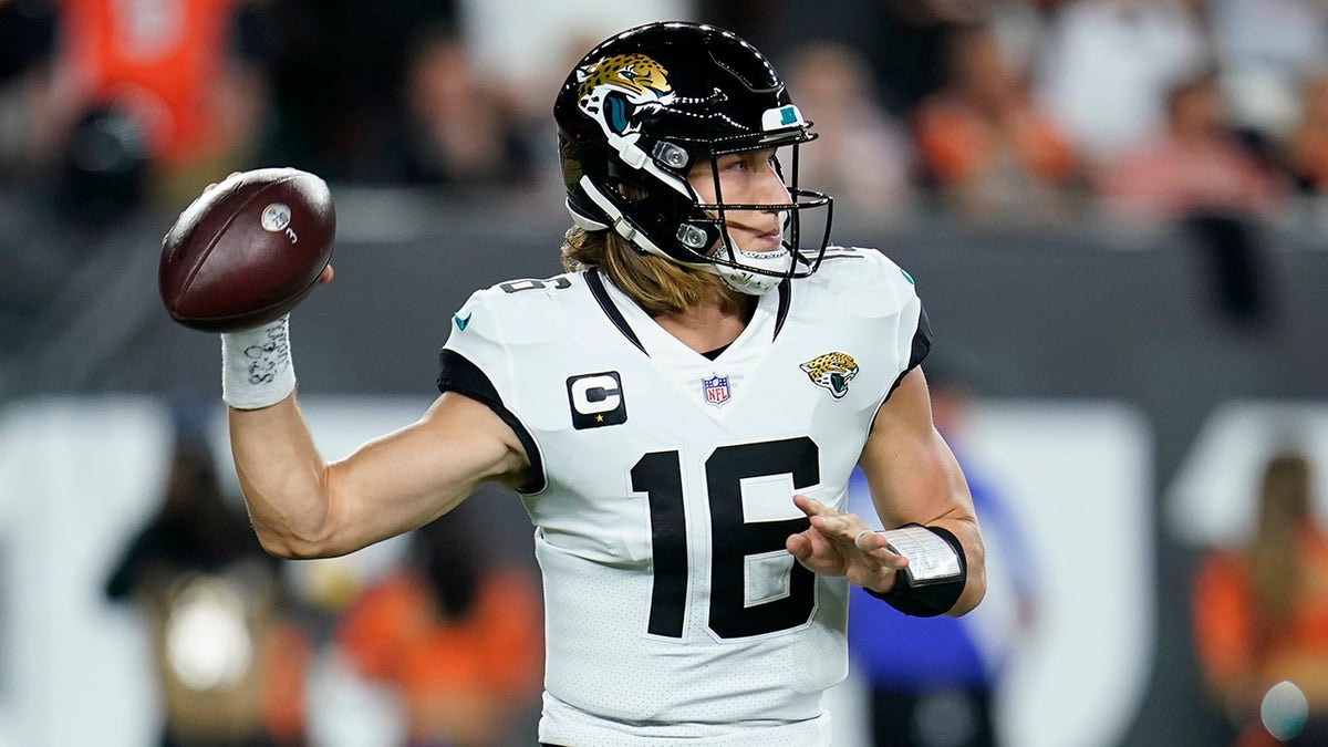 Jacksonville Jaguars quarterback Trevor Lawrence (16) throws during the first half of an NFL football game against the Cincinnati Bengals, Thursday, Sept. 30, 2021, in Cincinnati.