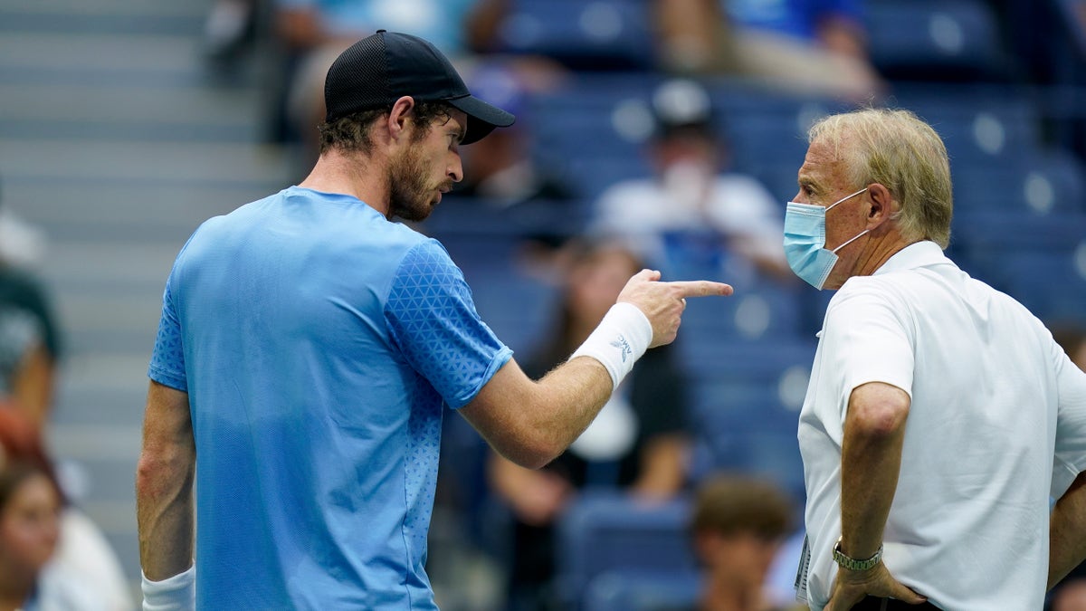 Andy Murray, of Great Britain, complains to an official between sets against Stefanos Tsitsipas, of Greece, during the first round of the US Open tennis championships