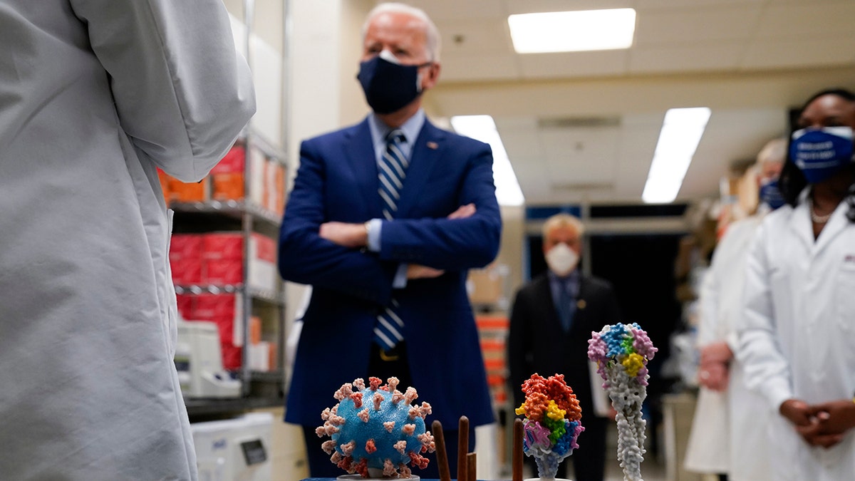 In this Feb. 11, 2021 file photo, President Joe Biden visits the Viral Pathogenesis Laboratory at the National Institutes of Health (NIH) in Bethesda, Md.