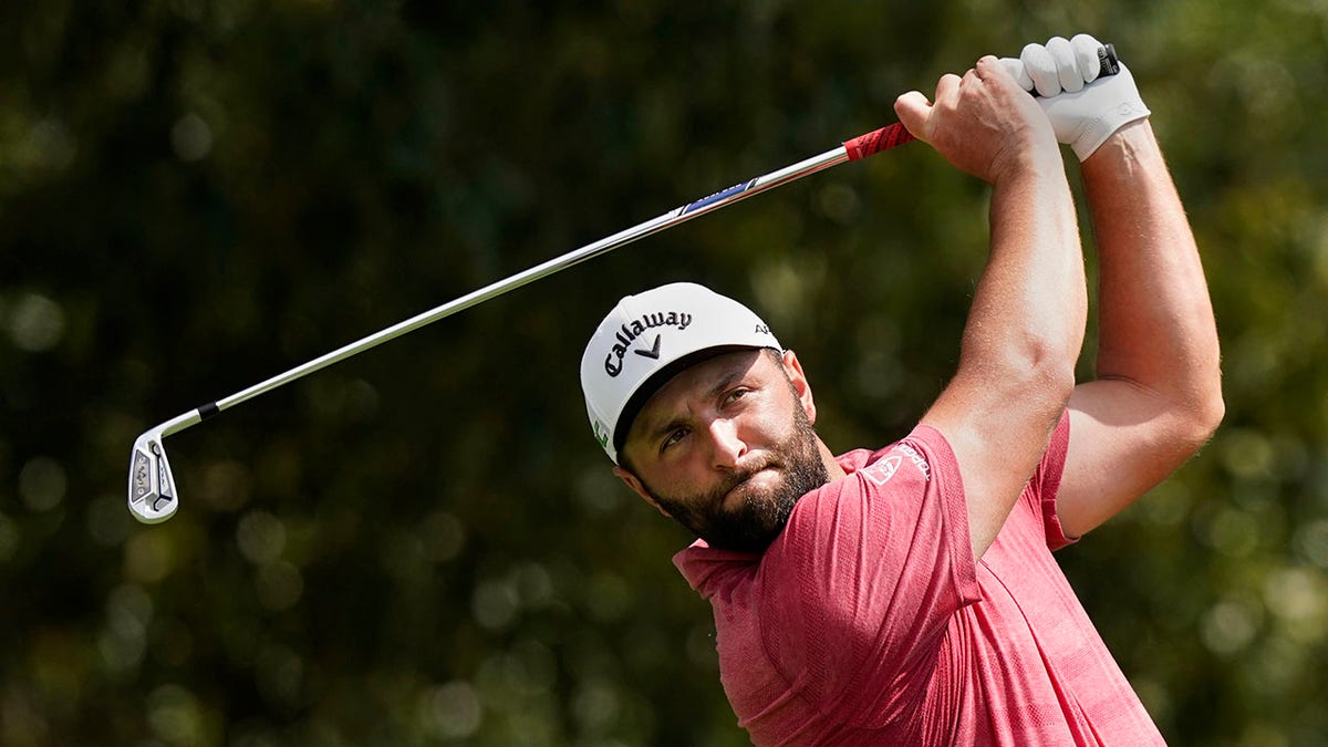 Jon Rahm hits from the fairway