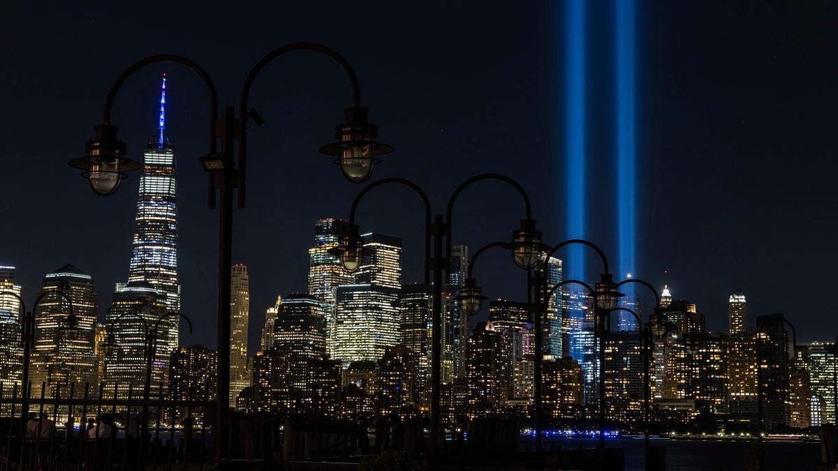 In this Sept. 11, 2020, file photo tribute in Light, two vertical columns of light representing the fallen towers of the World Trade Center shine against the lower Manhattan skyline on the 19th anniversary of the Sept. 11, 2001, terror attacks, seen from Jersey City, N.J. (AP Photo/Stefan Jeremiah, File)