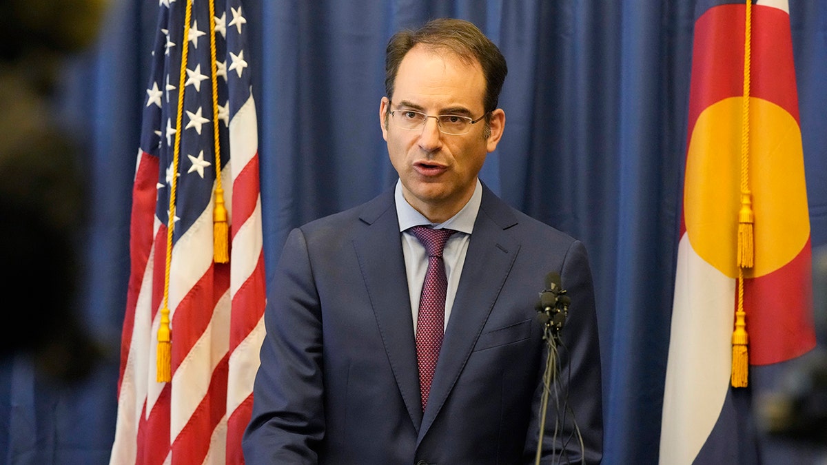In this Sept. 1, 2021, file photo, Colorado Attorney General Phil Weiser talks about a grand jury investigation into the death of Elijah McClain, a Black man who was put in a chokehold by police and injected with a powerful sedative two years ago, during a news conference in Denver.