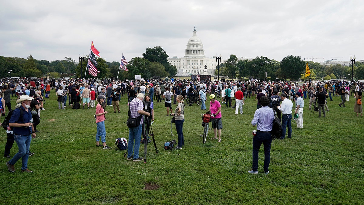 People attend a rally near the U.S. Capitol in Washington, Saturday, Sept. 18, 2021.