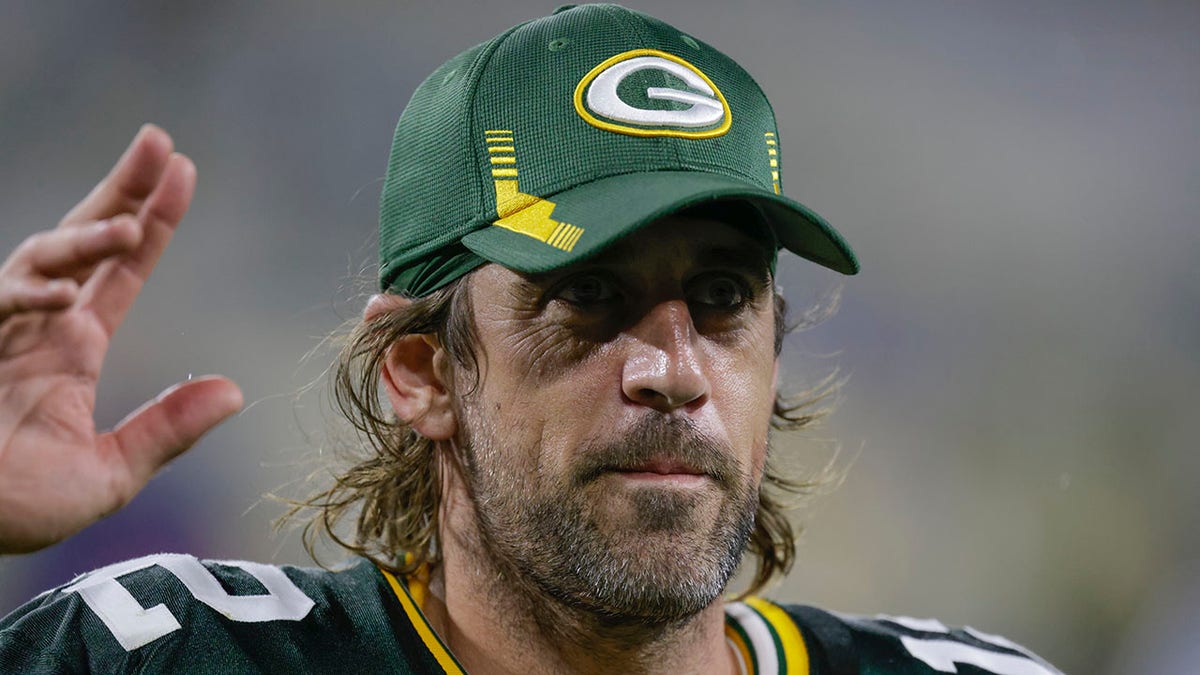 Green Bay Packers' Aaron Rodgers waves to fans as he leaves the field after an NFL football game against the Detroit Lions Monday, Sept. 20, 2021, in Green Bay, Wis. The Packers won 35-17. (AP Photo/Matt Ludtke)