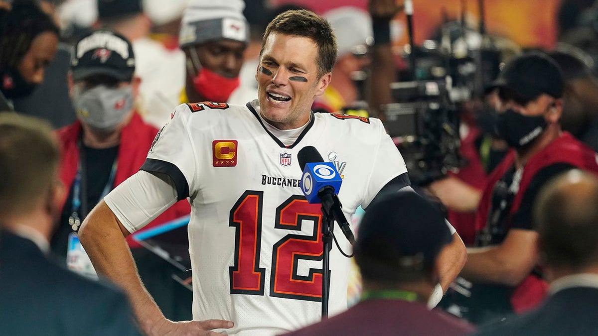 Tampa Bay Buccaneers quarterback Tom Brady is interviewed on the field after the the 2021 Super Bowl game with the Kansas City Chiefs in Tampa, Fla., Feb. 7, 2021.