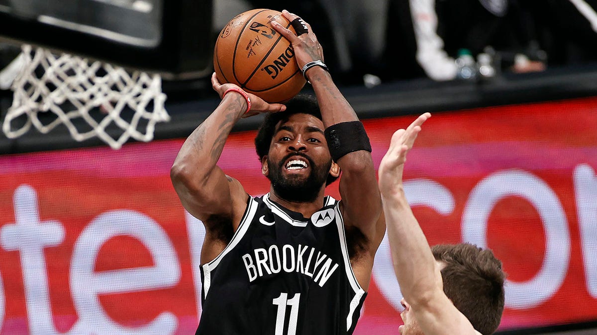 FILE - Brooklyn Nets guard Kyrie Irving (11) shoots against the Milwaukee Bucks during the second half of Game 1 of an NBA basketball second-round playoff series in New York, in this Saturday, June 5, 2021, file photo.