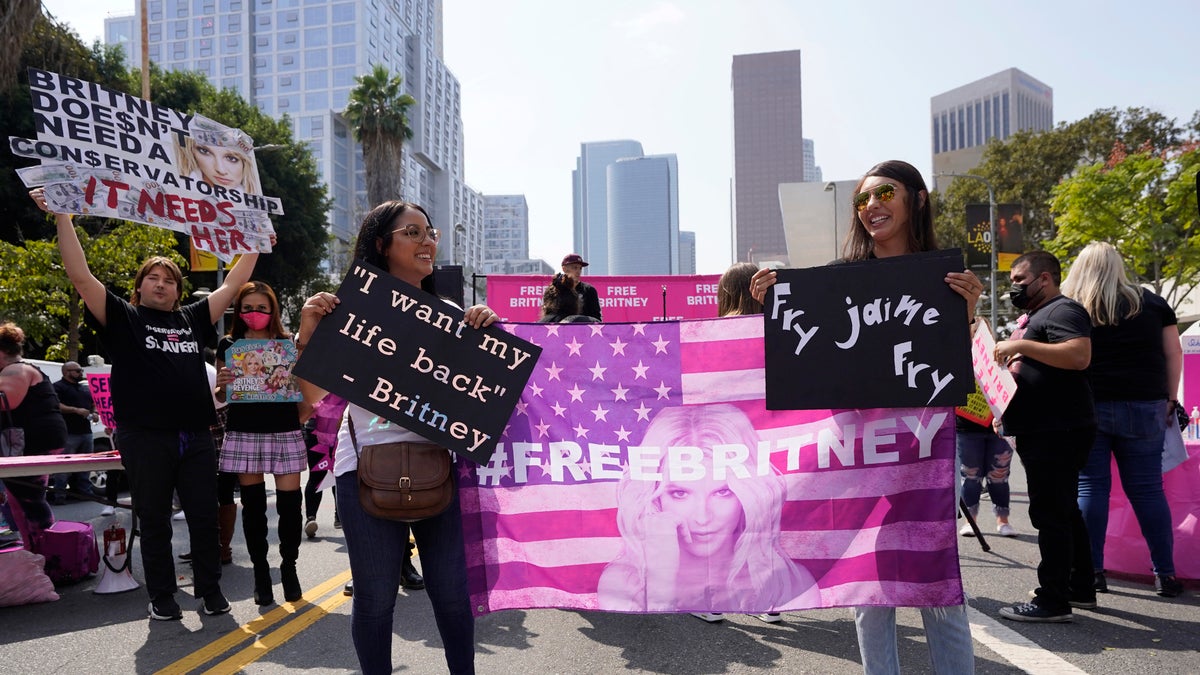 Britney Spears supporter Ashley Montano, left, and her sister-in-law Angela Montano demonstrate outside a hearing concerning the pop singer's conservatorship at the Stanley Mosk Courthouse, Wednesday, Sept. 29, 2021, in Los Angeles.