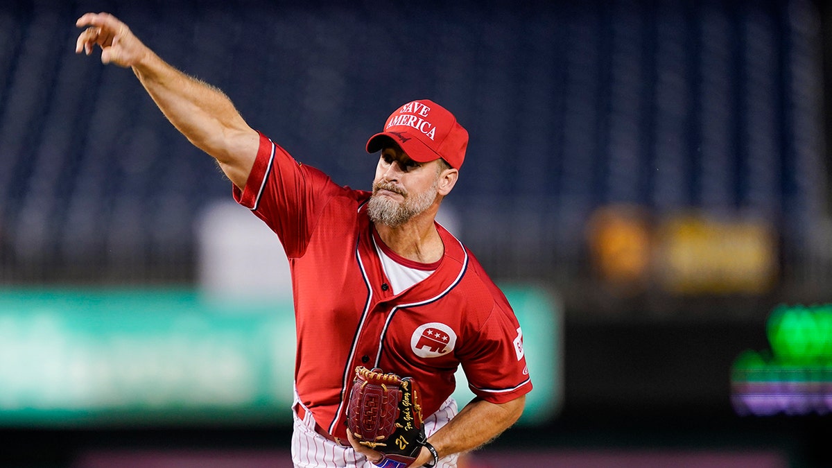Rep. Greg Steube, R-Fla., pitches during the first inning of the Congressional baseball game at Nationals Park Wednesday, Sept. 29, 2021, in Washington. (AP Photo/Alex Brandon)