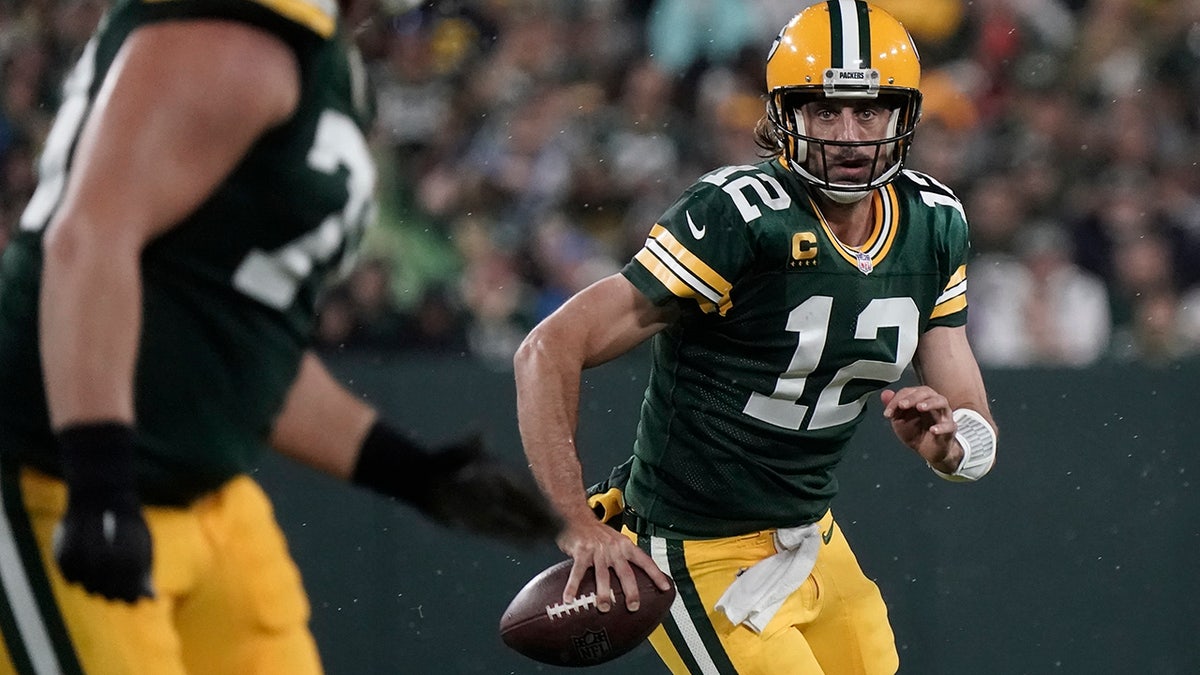 Green Bay Packers' Aaron Rodgers scrambles during the second half of an NFL football game against the Detroit Lions Monday, Sept. 20, 2021, in Green Bay, Wis. 
