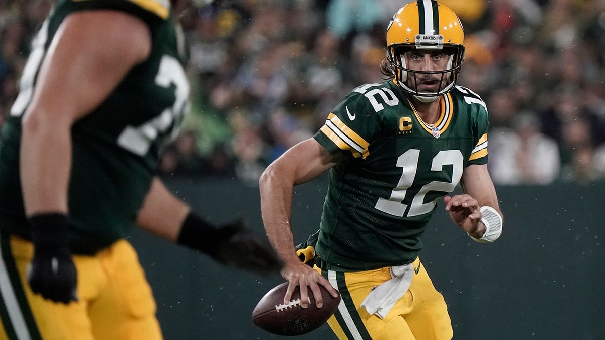 Green Bay Packers' Aaron Rodgers scrambles during the second half of an NFL football game against the Detroit Lions Monday, Sept. 20, 2021, in Green Bay, Wis.