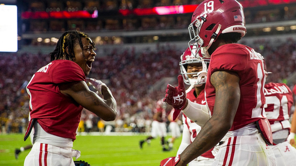 Alabama wide receiver Jameson Williams (1) celebrates with tight end Jahleel Billingsley (19) after Billingsley's touchdown against Southern Miss during the first half of an NCAA college football game, Saturday, Sept. 25, 2021, in Tuscaloosa, Ala.