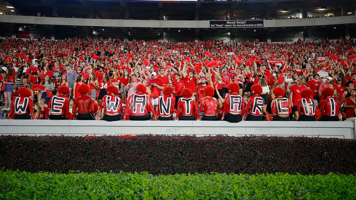 Georgia Bulldogs fans show their support for recruiting Arch Manning, who attended the game between the South Carolina Gamecocks and the Georgia Bulldogs at Sanford Stadium Sept. 18, 2021 in Athens, Georgia. 