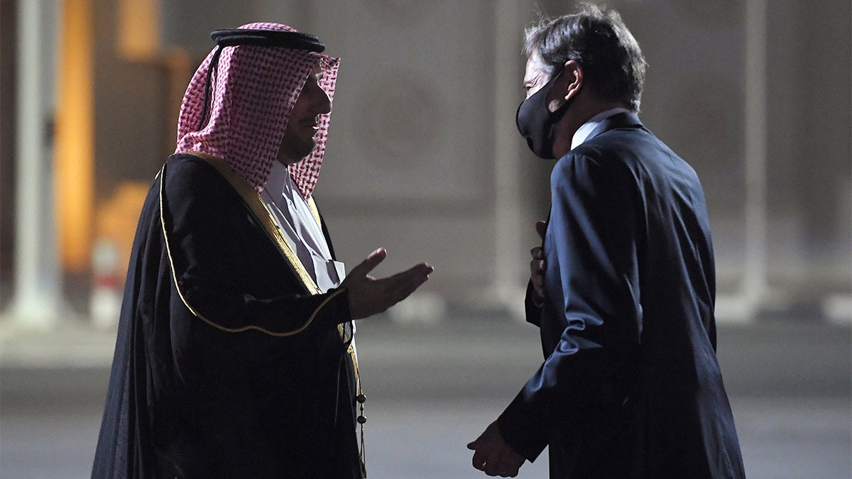 U.S. Secretary of State Antony Blinken, right, is welcomed upon his arrival by MFA Director of Protocol Ambassador Ibrahim Fakhroo at Old Doha Airport in Qatar's capital Monday, Sept. 6, 2021.