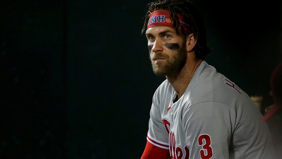 Sep 17, 2021; New York City, New York, USA; Philadelphia Phillies right fielder Bryce Harper (3) watches from the dugout during the third inning against the New York Mets at Citi Field.