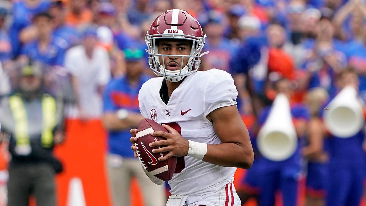 Alabama quarterback Bryce Young looks for a receiver during the first half of an NCAA college football game against Florida, Saturday, Sept. 18, 2021, in Gainesville, Fla. (AP Photo/John Raoux)