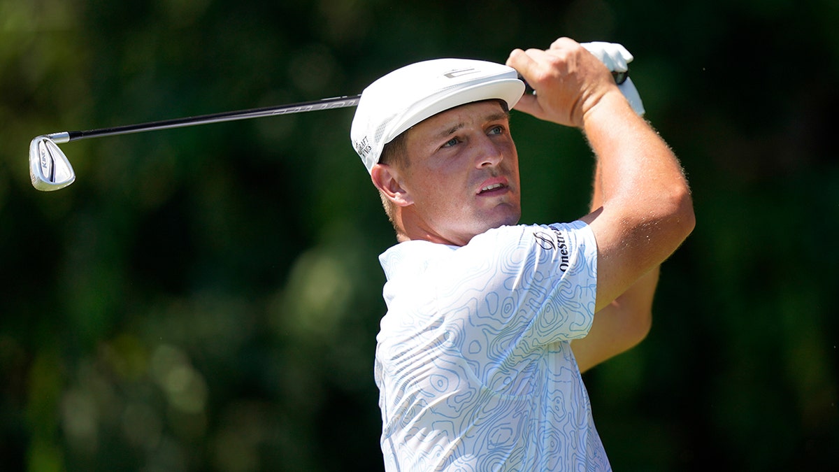 Bryson DeChambeau tees off