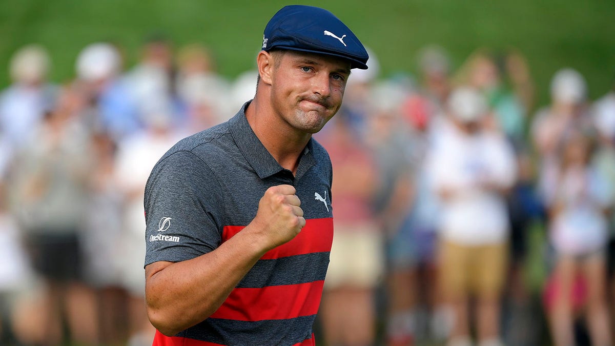 In this Aug. 29, 2021, file photo, Bryson DeChambeau reacts after sinking his putt on the 16th green during the final round of the BMW Championship golf tournament at Caves Valley Golf Club in Owings Mills, Md.