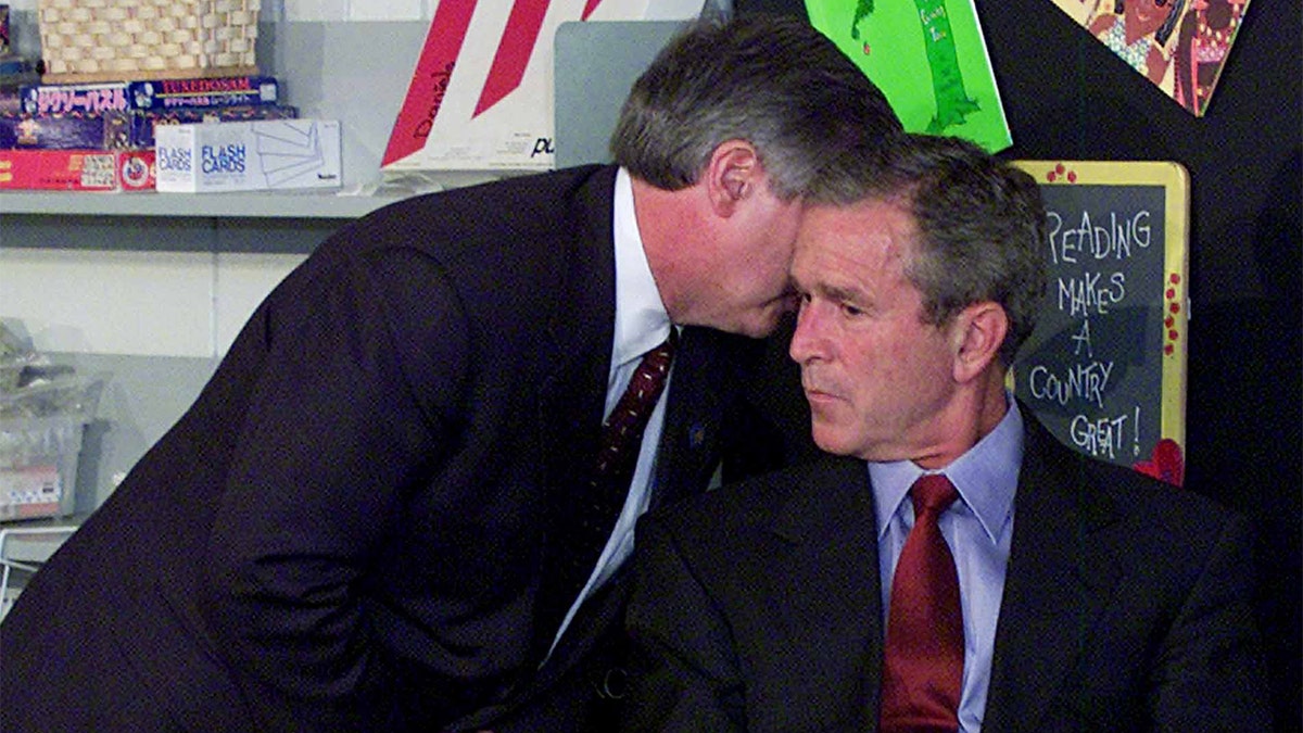 Chief of Staff Andy Card is photographed whispering in President George Bush's ear about the terrorist attacks on 9/11/01